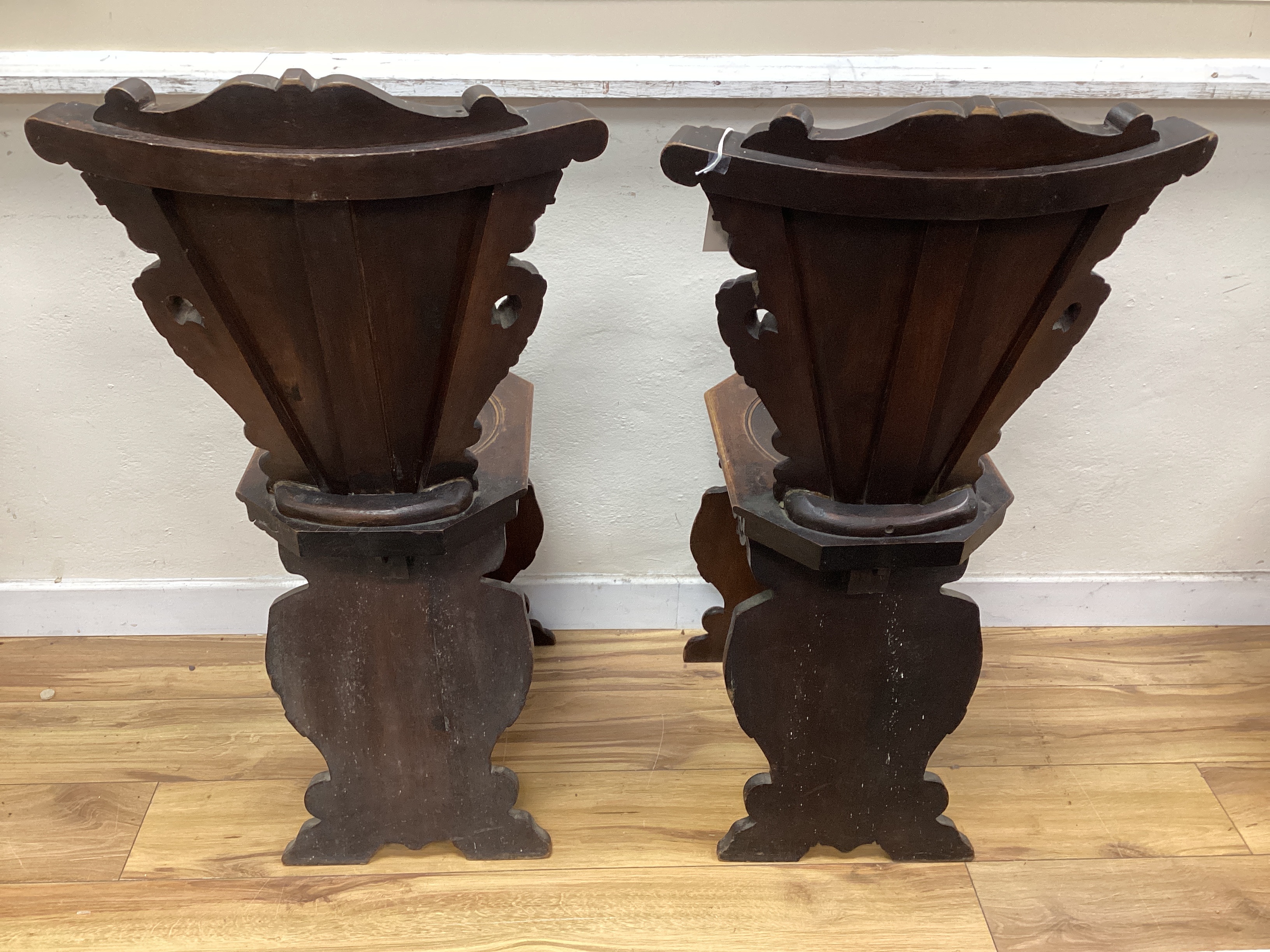 A pair of 18th century style Italian carved walnut hall chairs, width 48cm, depth 42cm, height 94cm.